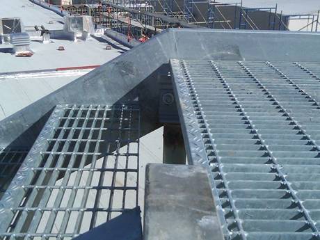 Cement plant steel bar grating is used as stair treads and floors.