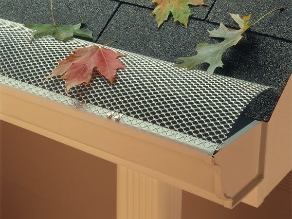 Leaves fall on the half round aluminum hinged gutter guard.