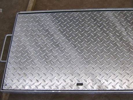 A compound steel grating with two armrests on the two sides.