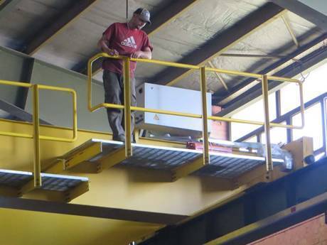 A worker is standing on the operating platform to look down.