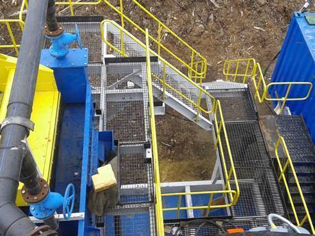 This is dense medium separation machinery with steel grating stairs and walkway.