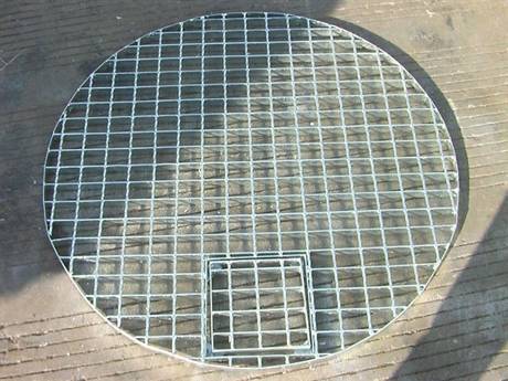 This is a well cover made of special shaped steel grating.