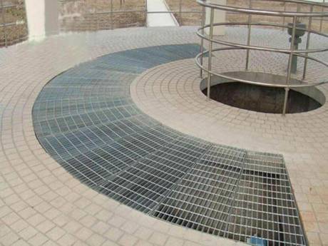 This is a round platform with sector shaped steel grating.