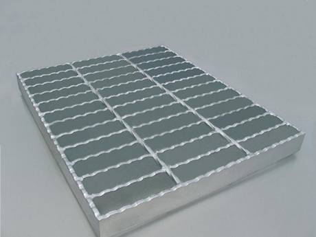 A galvanized steel bar grating with serrated loading bar.