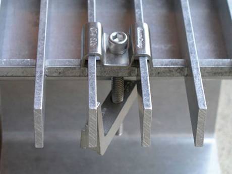 This is a saddle clip in steel grating.