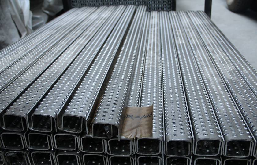 Several traction-grip safety grating for ladder rungs stacking neatly together.