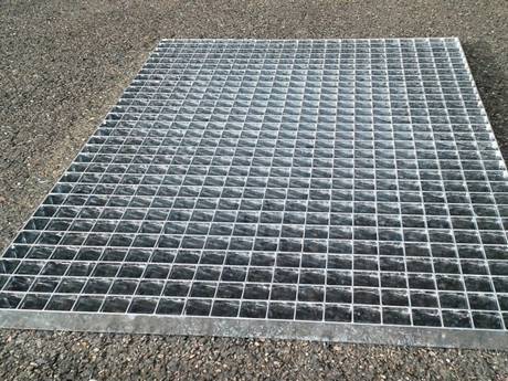 A piece of press locked steel grating mat without frame.