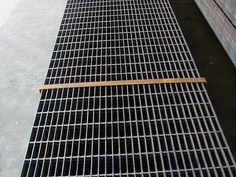 A bundle of welded steel gratings on the ground.