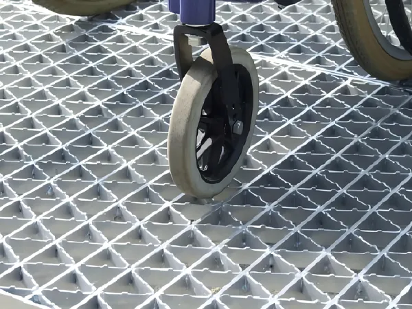 Diamond pattern steel grating used in walkway and traffic areas.