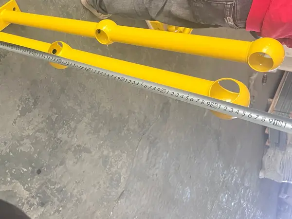 Measure the length of grating ball joint stanchions with a tape.
