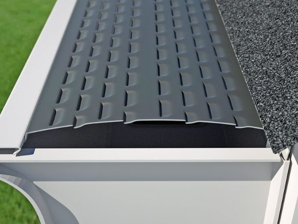 A piece of louvered aluminum gutter guard is displayed.