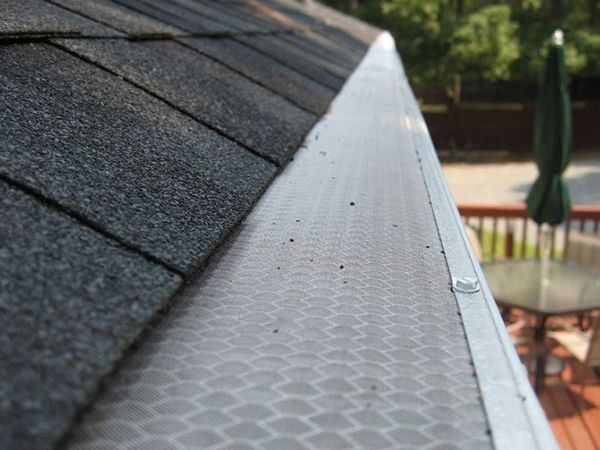 Micro mesh aluminum gutter guard is installed above the gutter system.