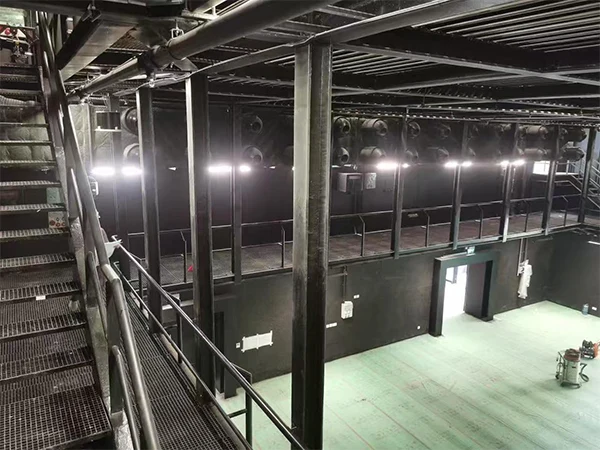 Black painted steel grating installed in indoor venues as a platform