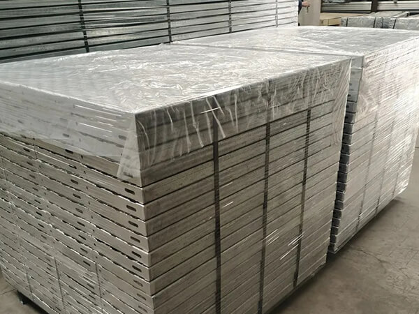 Several bundle of perforated steel grating in the warehouse.