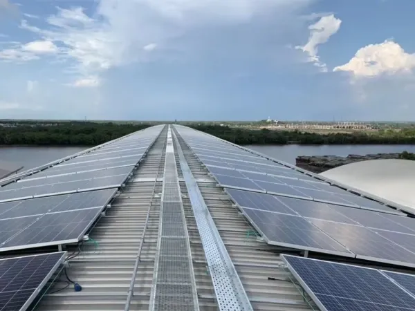 Rooftop solar panel walkways along a metal roof