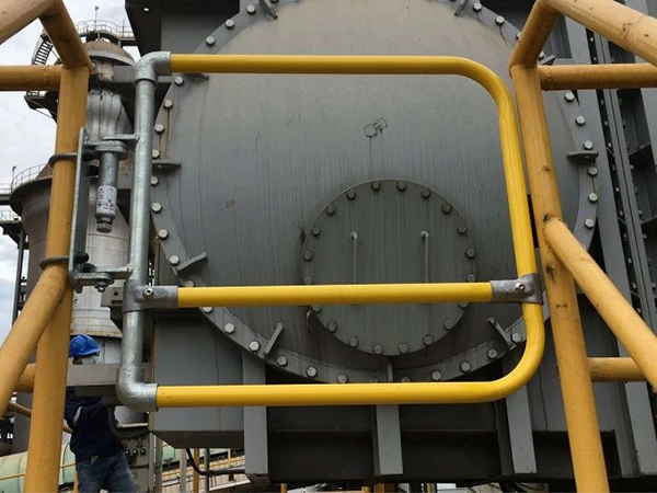 Installation of self-closing safety gate at the entrance to large machinery