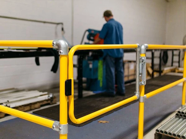 self-closing safety gate installed at the production line to protect workers
