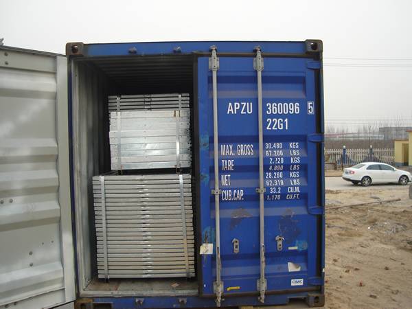 Half closed door of container is full of welded steel gratings.