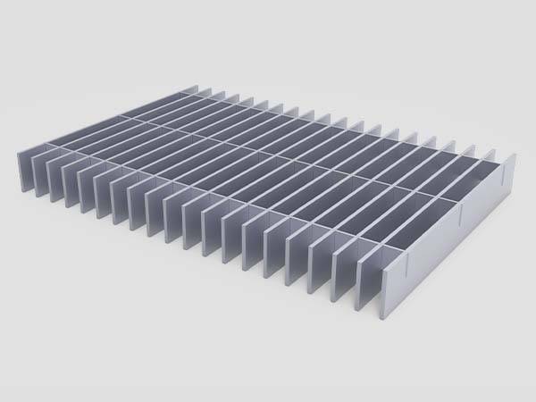 Swaged flush-top aluminum grating with a plain surface is displayed.