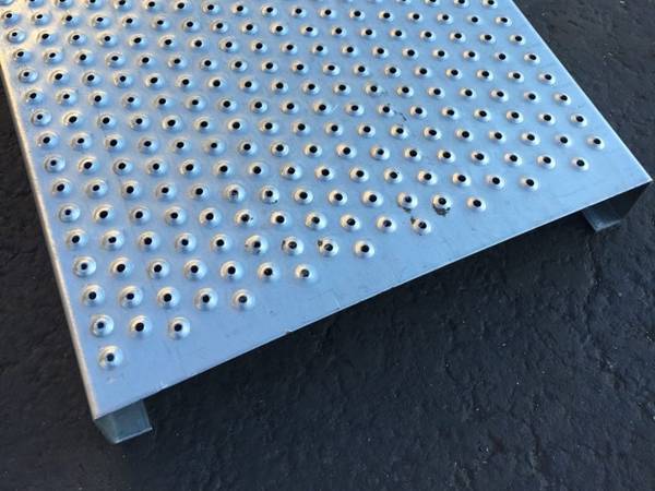 A piece of traction-grip safety grating is displayed.